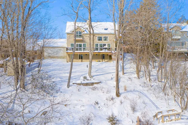 a view of a chairs with table in the patio