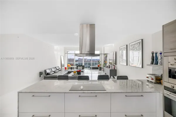 a kitchen with a cabinets and white appliances