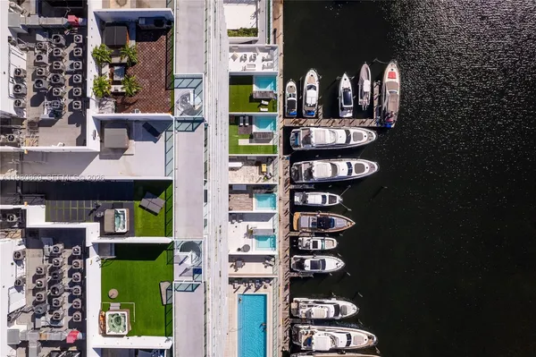 a view of a chairs and table in a backyard