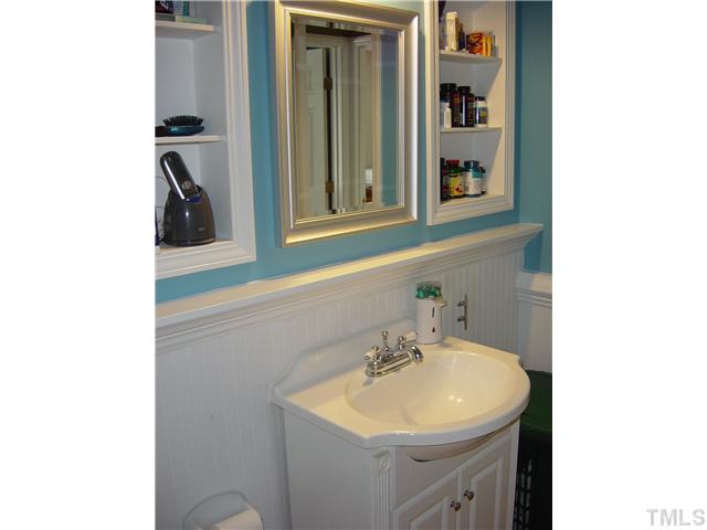 4808 Gun Powder Place Raleigh, NC 27616 - Photo 16 of 23 a bathroom with a sink and a mirror