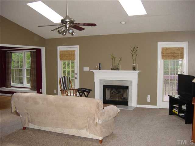 4808 Gun Powder Place Raleigh, NC 27616 - Photo 2 of 23 a living room with furniture and a fireplace