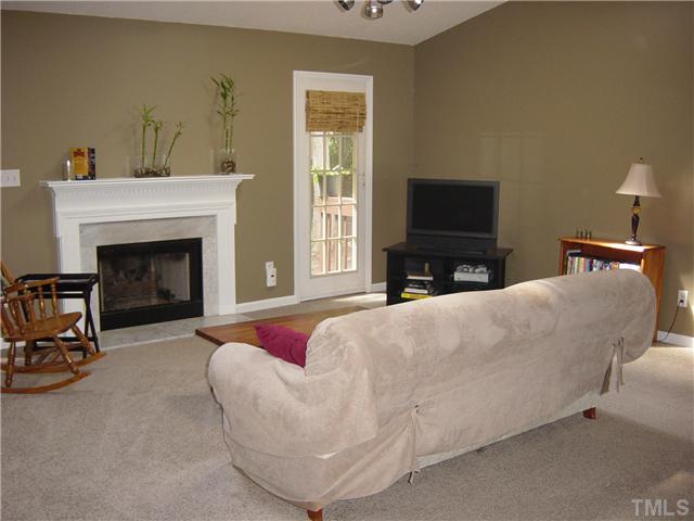 4808 Gun Powder Place Raleigh, NC 27616 - Photo 4 of 23 a living room with furniture and a fireplace