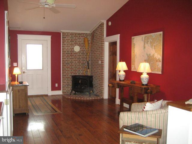 1612 Deep Point Road Woolford, MD 21677 - Photo 1 of 30 a living room with furniture and a fireplace