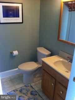 1612 Deep Point Road Woolford, MD 21677 - Photo 13 of 30 a white toilet sitting next to a bathroom sink