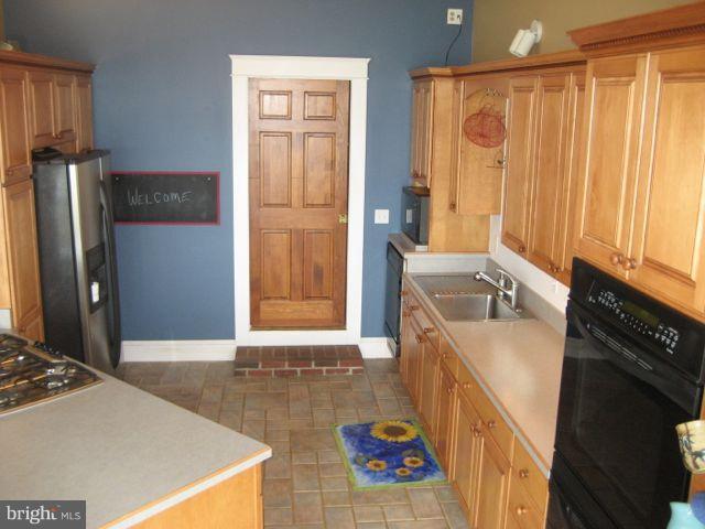 1612 Deep Point Road Woolford, MD 21677 - Photo 19 of 30 a bathroom with a sink a granite counter top and a window