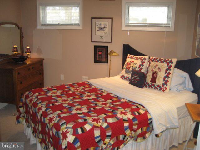 1612 Deep Point Road Woolford, MD 21677 - Photo 20 of 30 a bedroom with a bed and painting on the wall