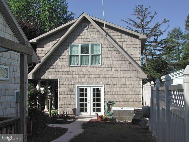 1612 Deep Point Road Woolford, MD 21677 - Photo 22 of 30 a front view of a house with a yard