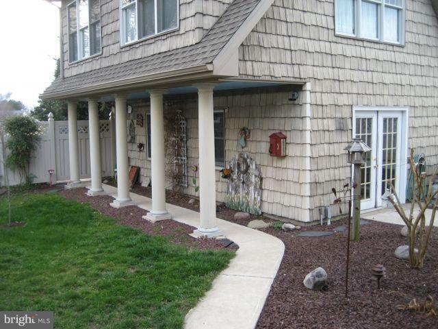 1612 Deep Point Road Woolford, MD 21677 - Photo 27 of 30 a front view of a house with a garden
