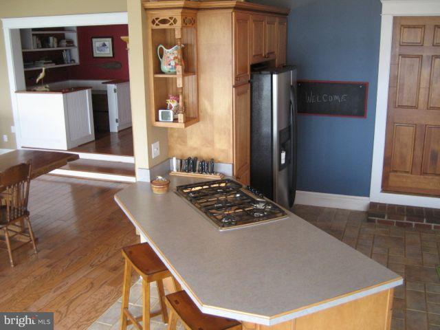 1612 Deep Point Road Woolford, MD 21677 - Photo 5 of 30 a living room with stainless steel appliances granite countertop furniture and a refrigerator