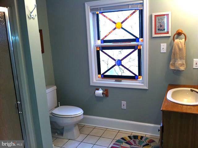 1612 Deep Point Road Woolford, MD 21677 - Photo 6 of 30 a bathroom with a toilet and a sink