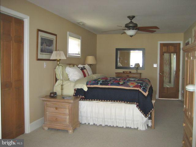 1612 Deep Point Road Woolford, MD 21677 - Photo 8 of 30 a bed room with a bed and two mirror