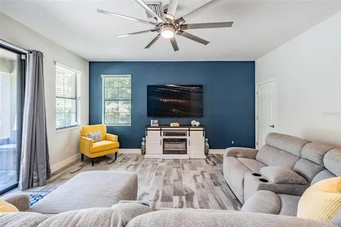 a living room with furniture and a large window