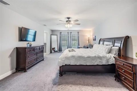 a bathroom with a granite countertop sink two mirror and a