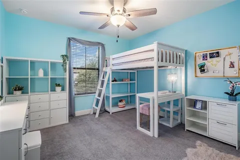 a view of a livingroom with furniture and a window