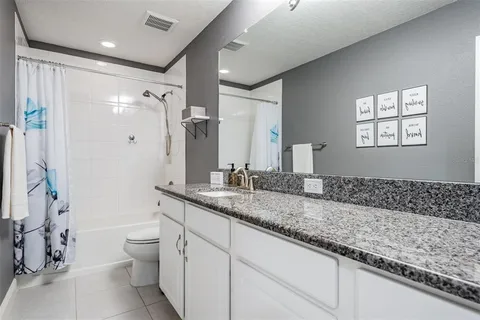 a view of a room with furniture and a window