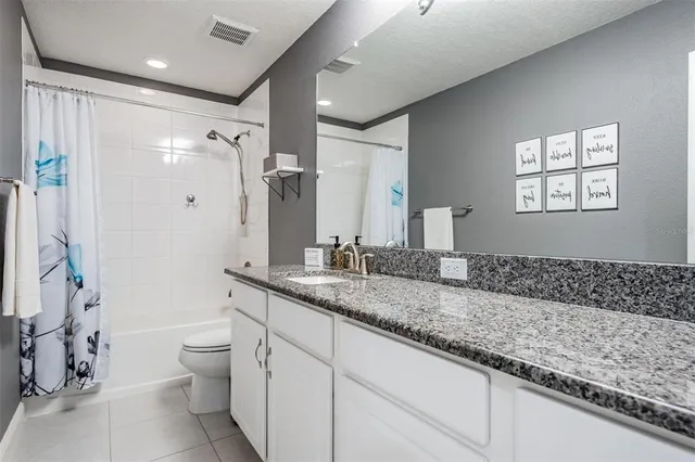 a view of a room with furniture and a window