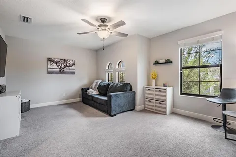 a view of yard with swimming pool and green space