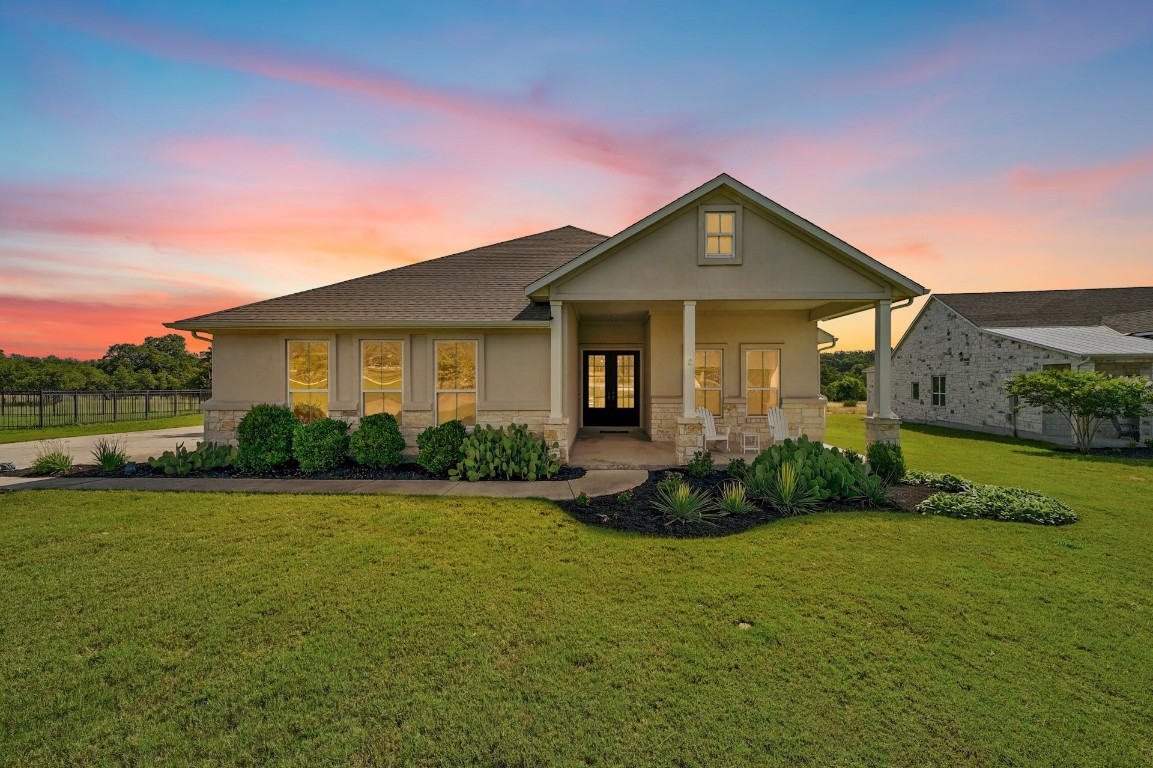 707 Sapling Drive Driftwood, TX 78619 - Photo 1 of 1 a front view of a house with garden