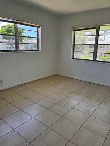 a view of an empty room with a window