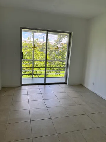 a view of a garden and deck