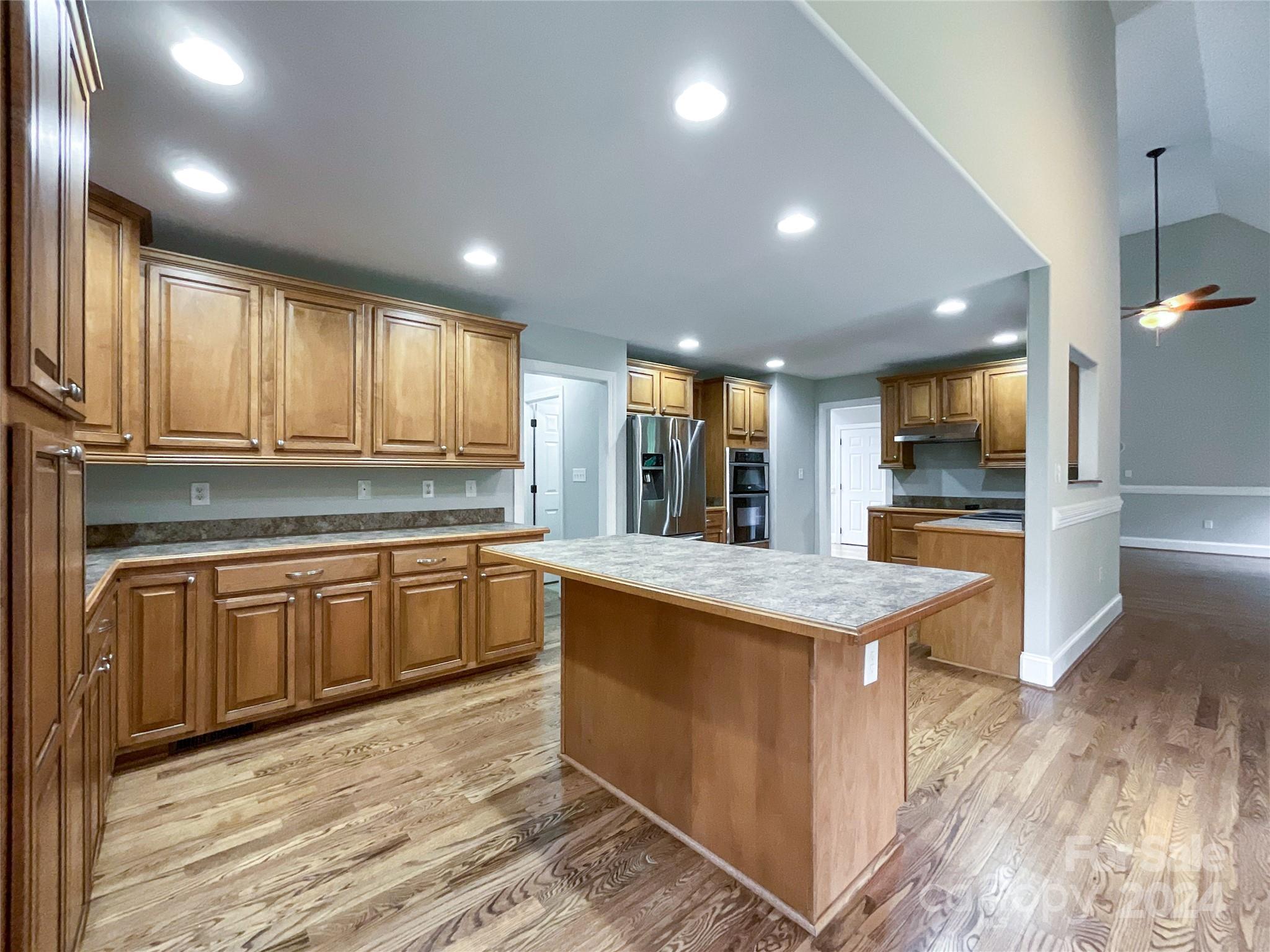 2510 Doster Road Monroe, NC 28112 - Photo 14 of 48 a kitchen with stainless steel appliances granite countertop a sink stove and refrigerator