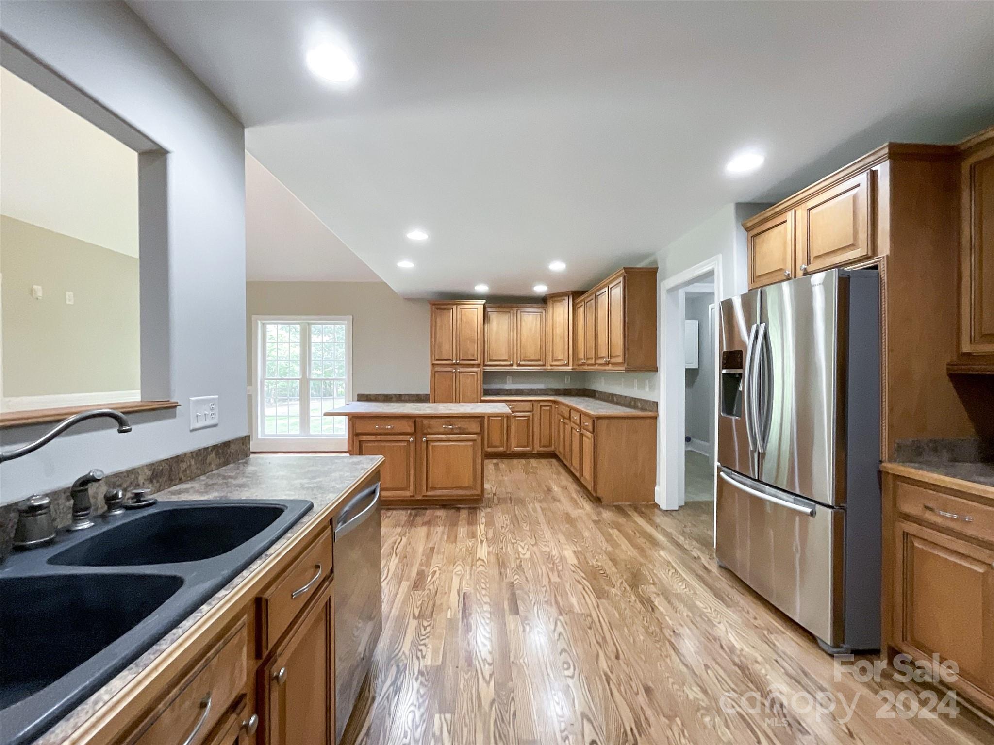 2510 Doster Road Monroe, NC 28112 - Photo 20 of 48 a kitchen with a refrigerator sink and cabinets