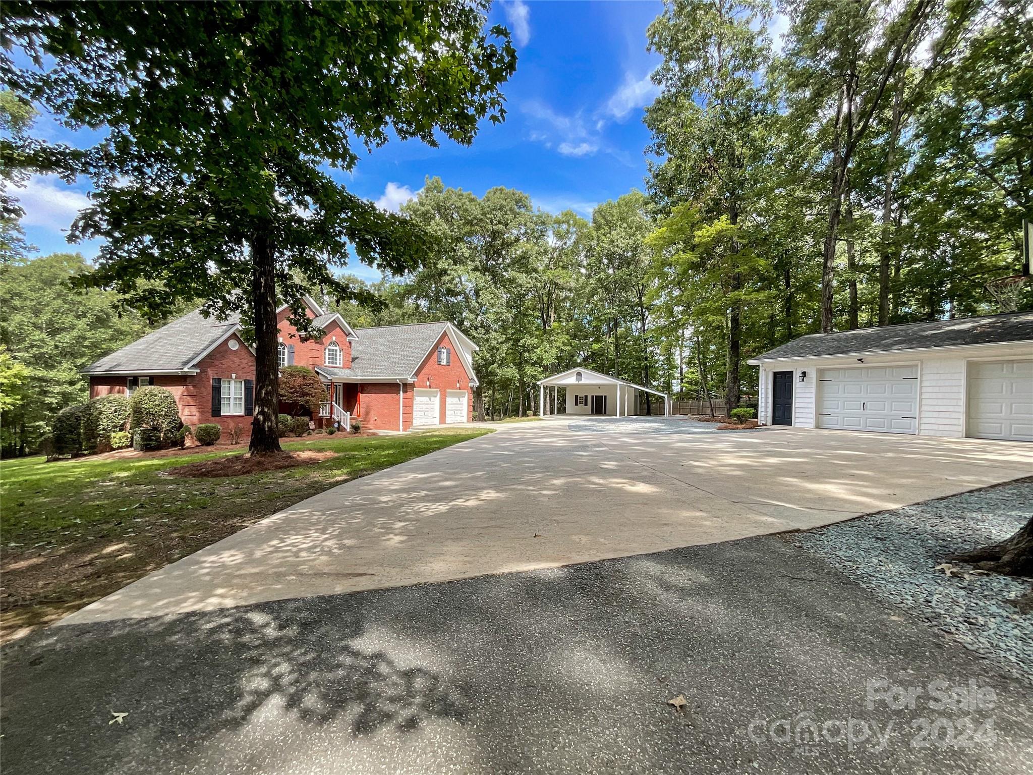 2510 Doster Road Monroe, NC 28112 - Photo 2 of 48 a front view of a house with a yard and garage