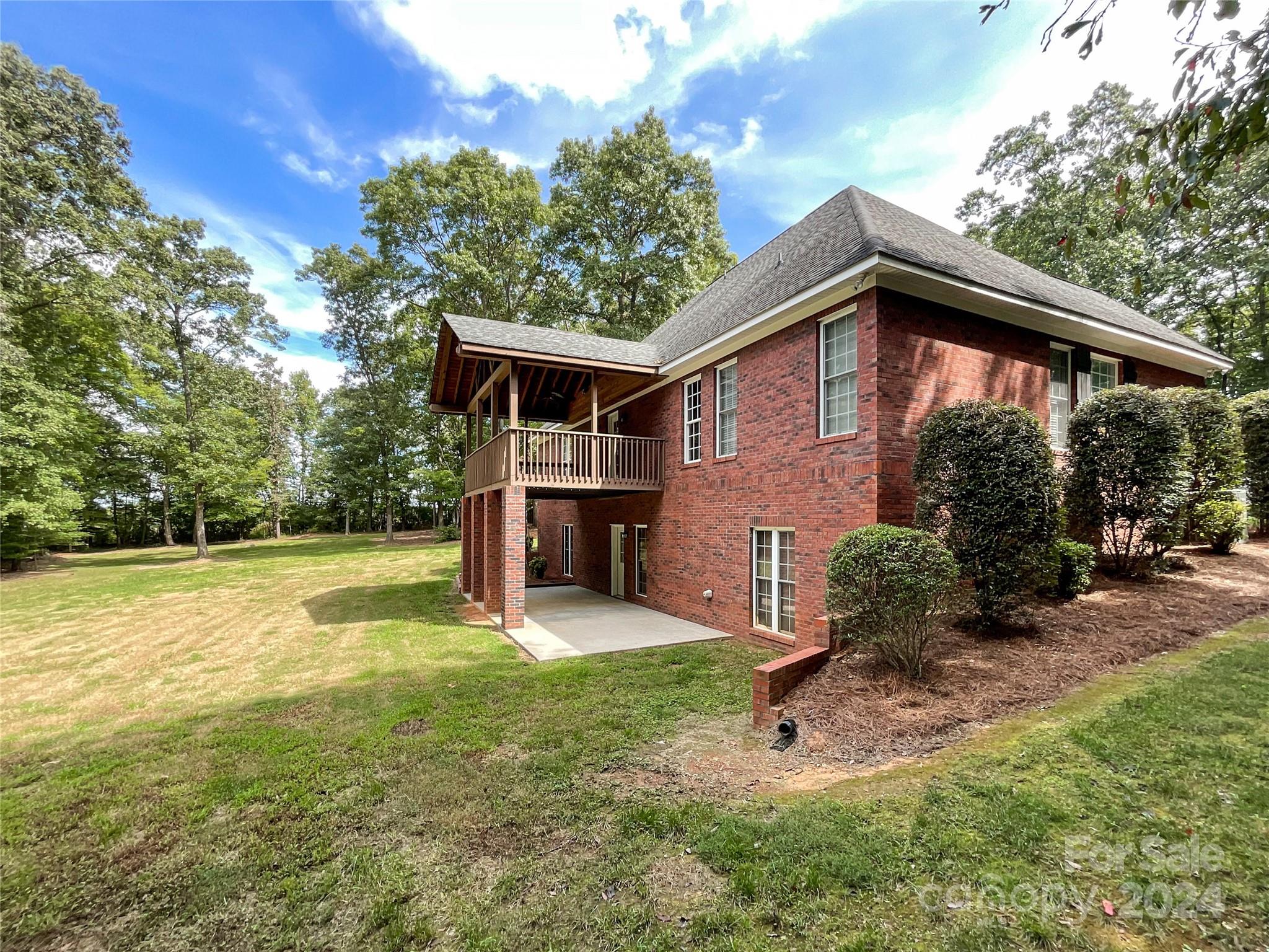 2510 Doster Road Monroe, NC 28112 - Photo 4 of 48 a front view of house with yard and trees in the background