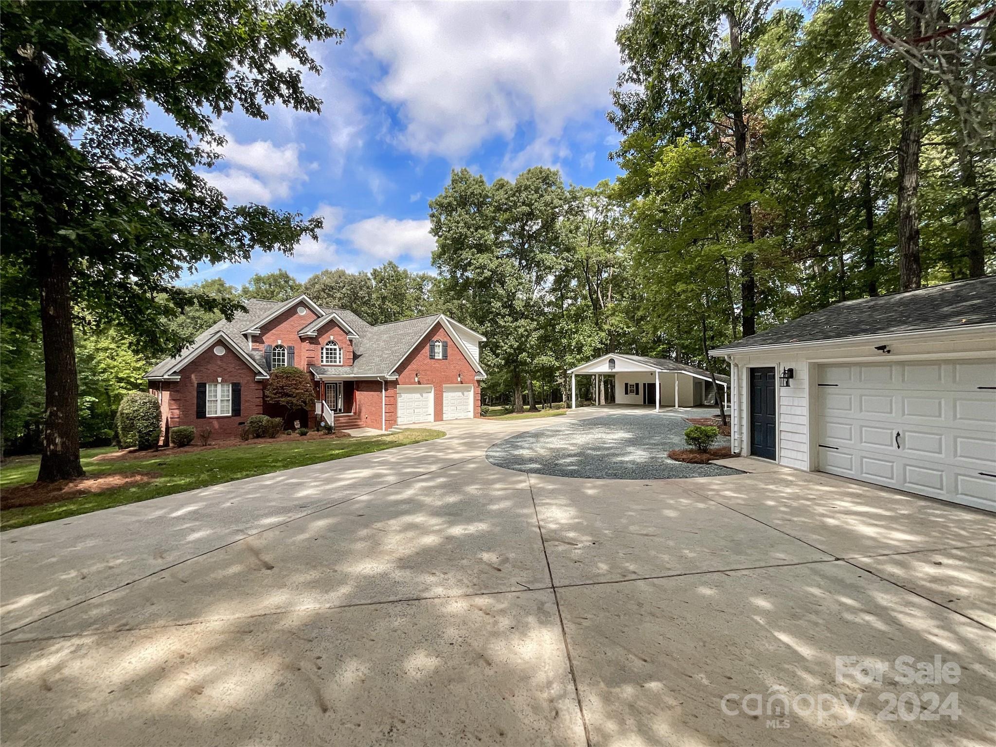 2510 Doster Road Monroe, NC 28112 - Photo 45 of 48 a front view of a house with a yard and garage