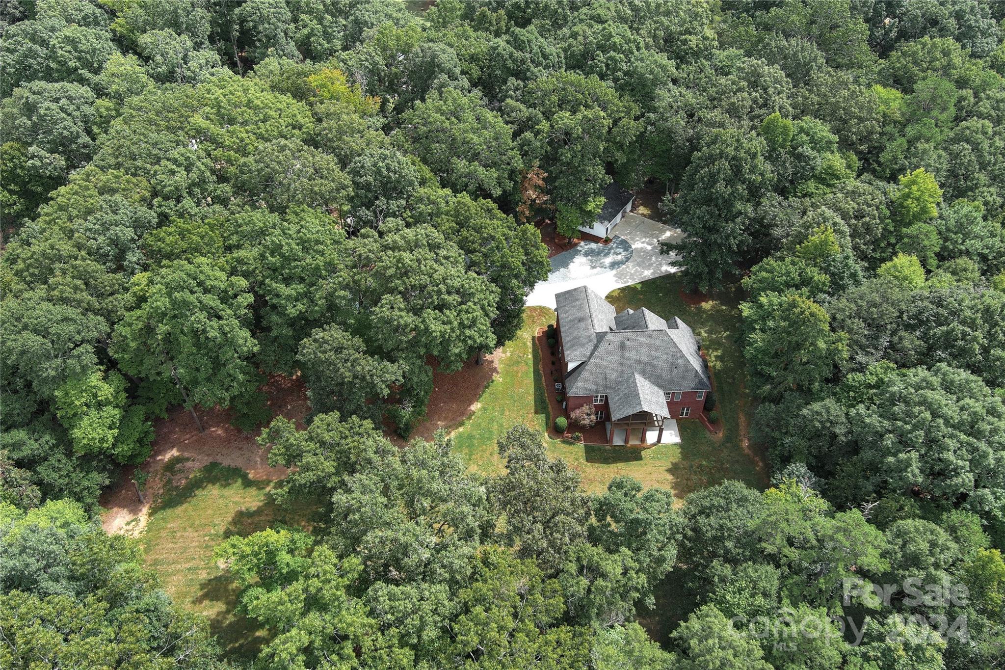 2510 Doster Road Monroe, NC 28112 - Photo 47 of 48 an aerial view of a house with a yard and large trees