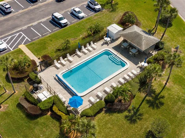 a view of a swimming pool with a patio