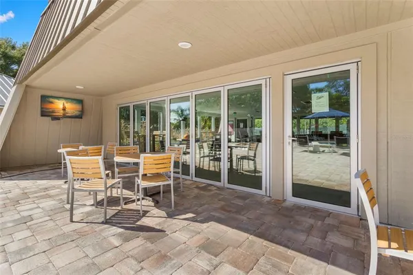 a view of a house with a yard and sitting area