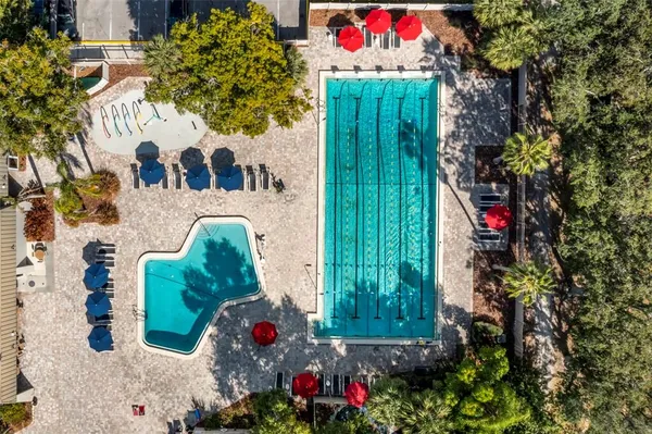 a view of swimming pool with an outdoor space and seating area