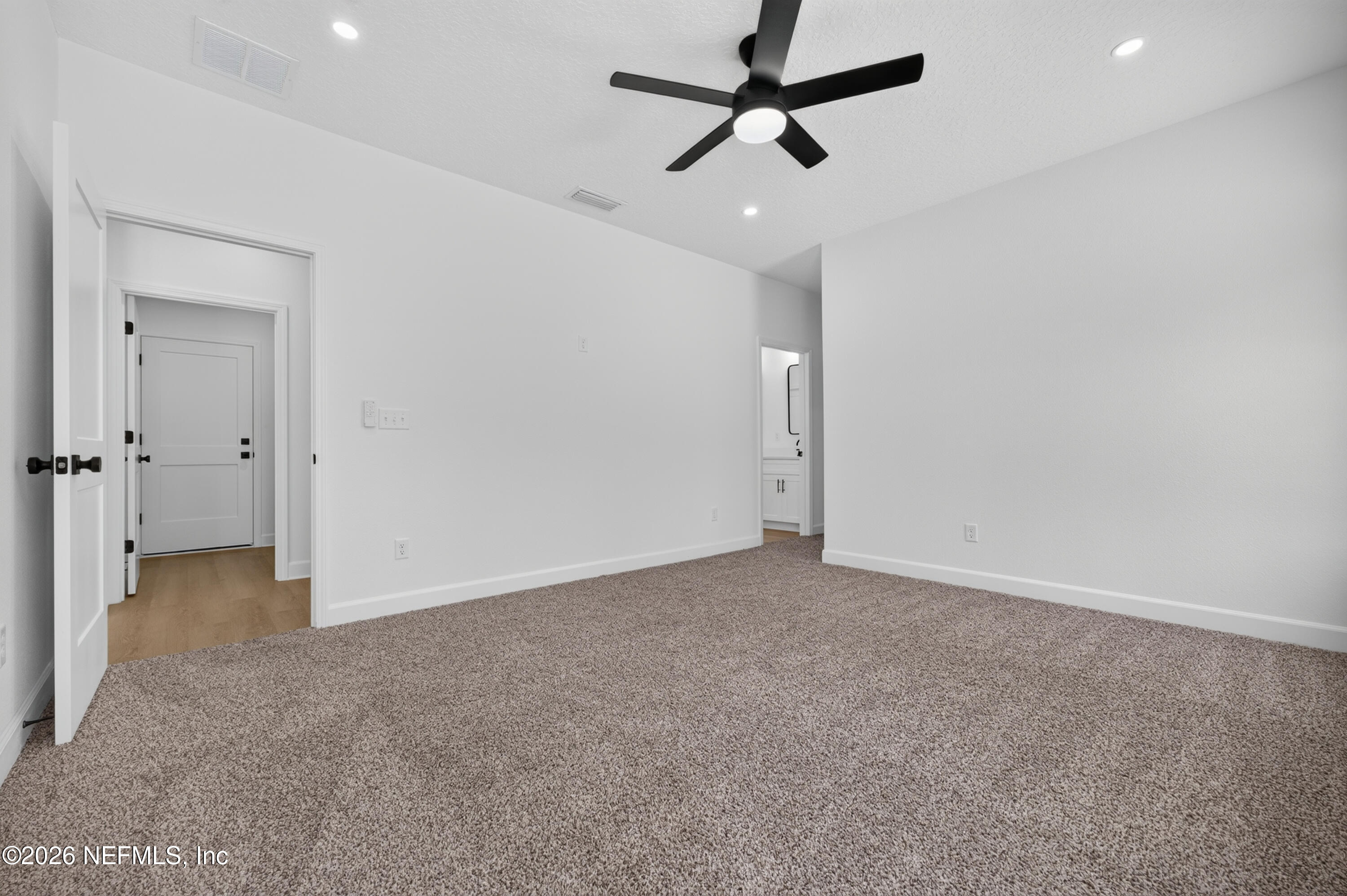 4362 Angora Street Middleburg, FL 32068 - Photo 11 of 31 an empty room with closet and a ceiling fan