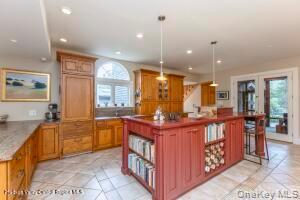 16 Sahler Mill Road Olivebridge, NY 12461 - Photo 8 of 50 a kitchen with stainless steel appliances kitchen island granite countertop a stove a sink and a refrigerator