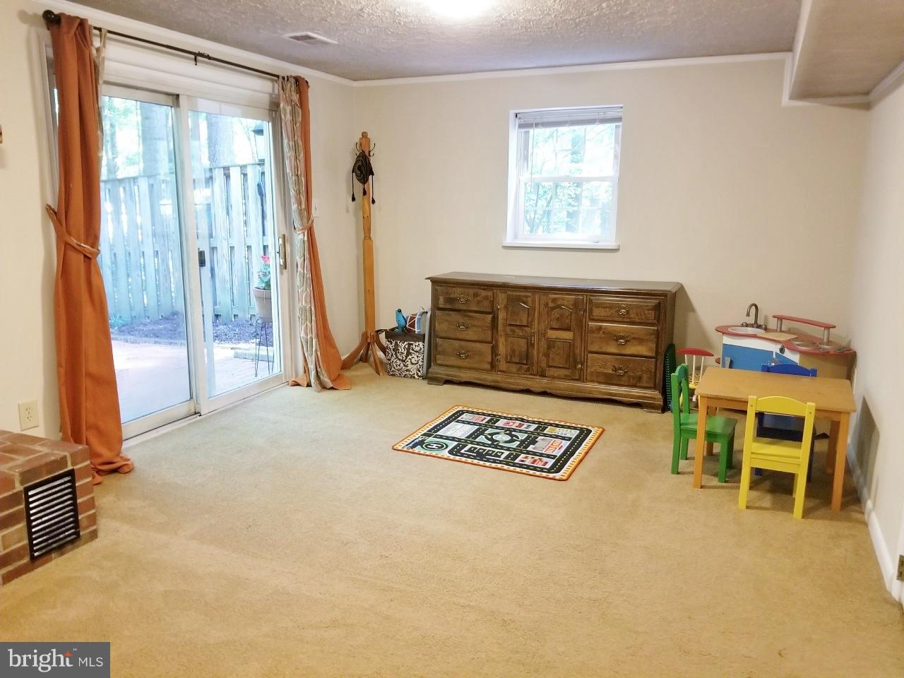 5602 Kirkham Court Springfield, VA 22151 - Photo 8 of 22 Carpeted family room walk out to brick patio.