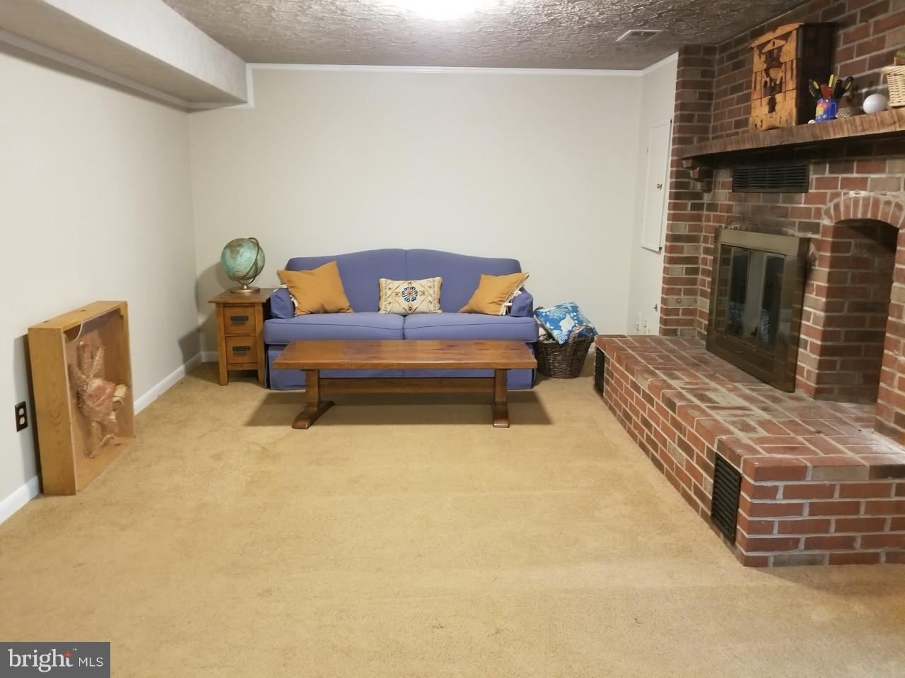 5602 Kirkham Court Springfield, VA 22151 - Photo 9 of 22 Large basement features fireplace and walkout.