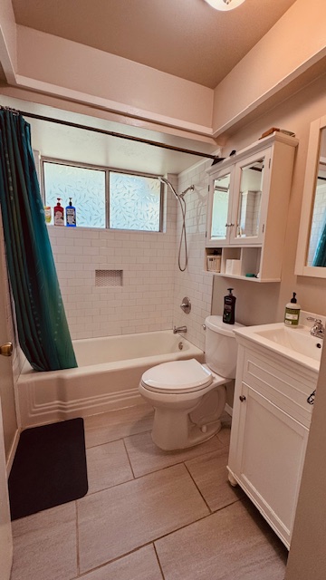 4614 Raintree Boulevard Austin, TX 78745 - Photo 8 of 14 a bathroom with a sink a toilet and shower