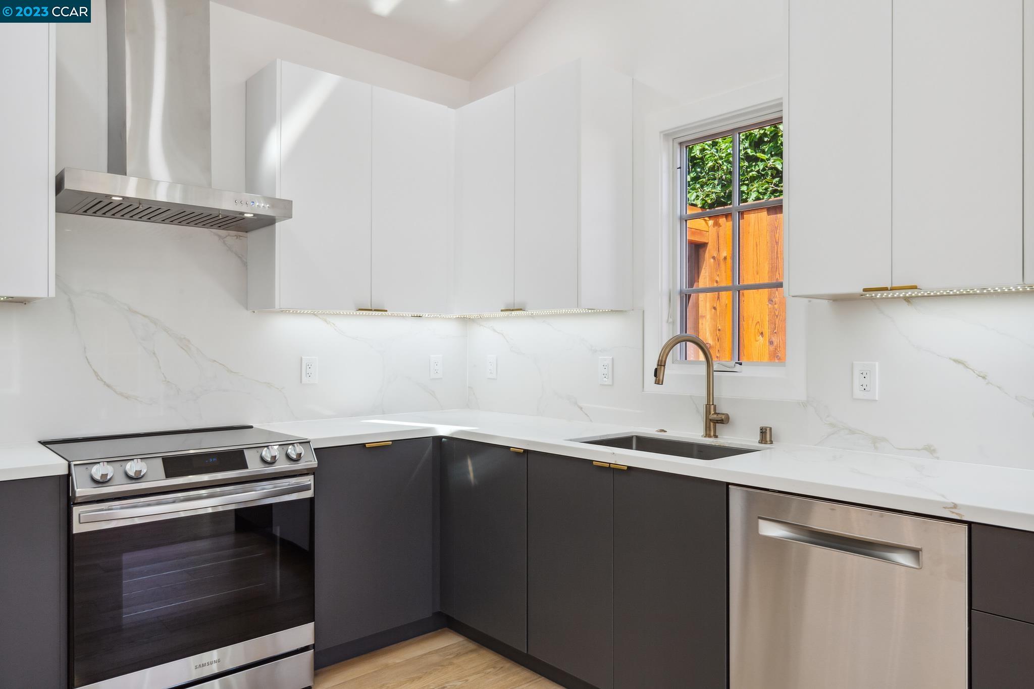 833 Paramount Road Oakland, CA 94610 - Photo 5 of 15 a kitchen with a sink stove and cabinets
