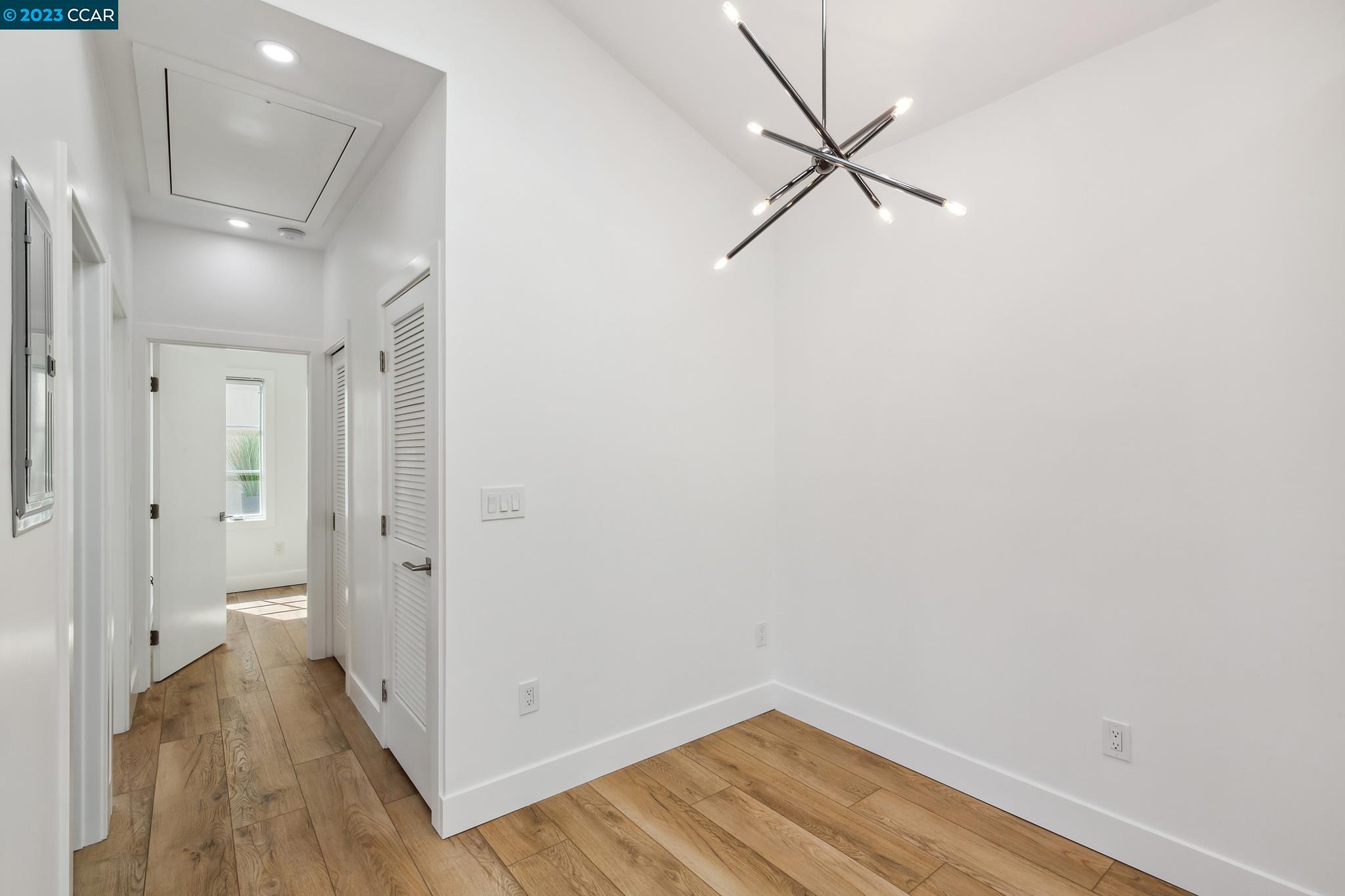833 Paramount Road Oakland, CA 94610 - Photo 8 of 15 a view of a room with wooden floor and a ceiling fan