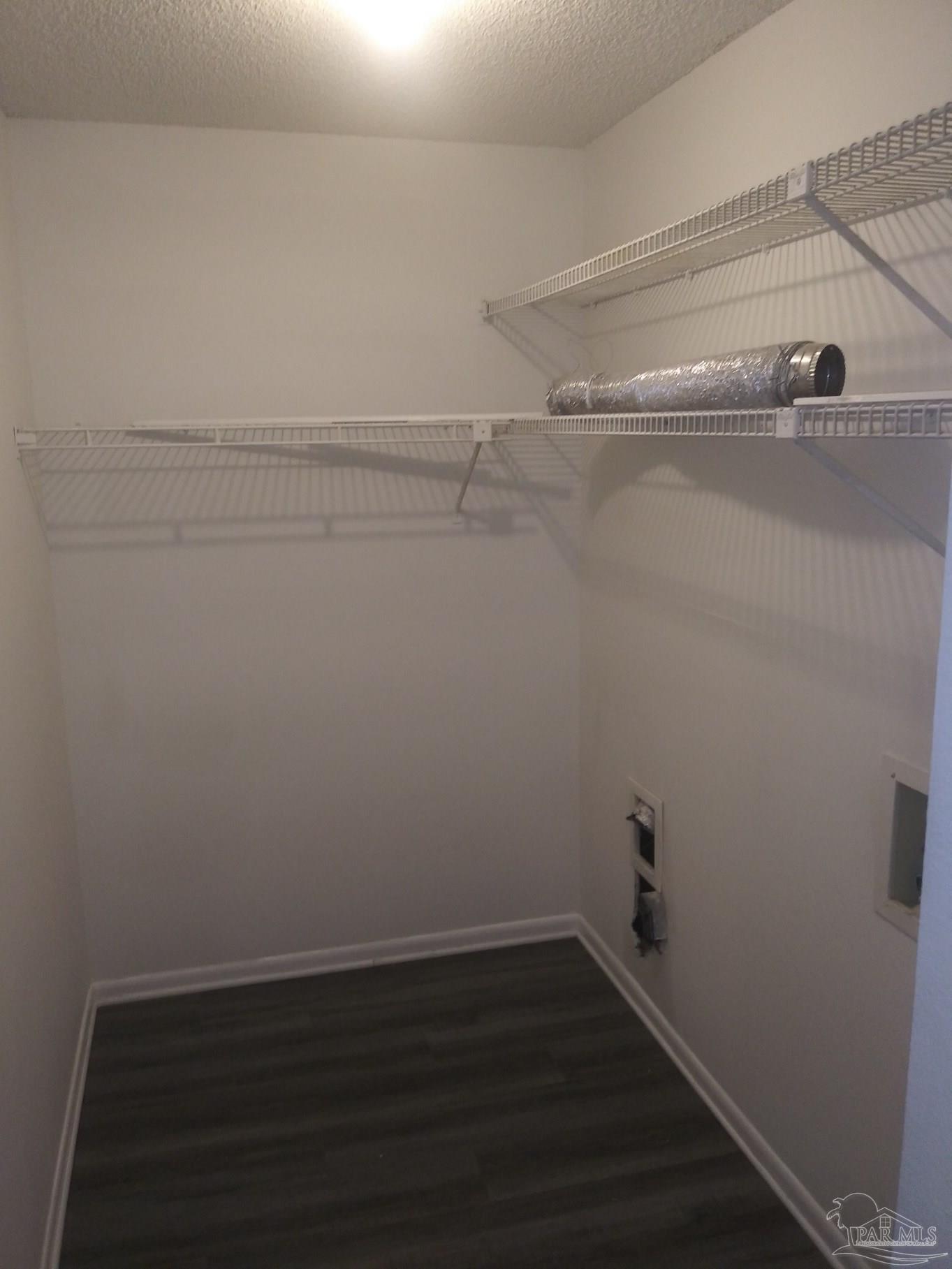 6288 Hamilton Bridge Road, Unit 501 Milton, FL 32570 - Photo 9 of 12 a view of a room with racks on the wall