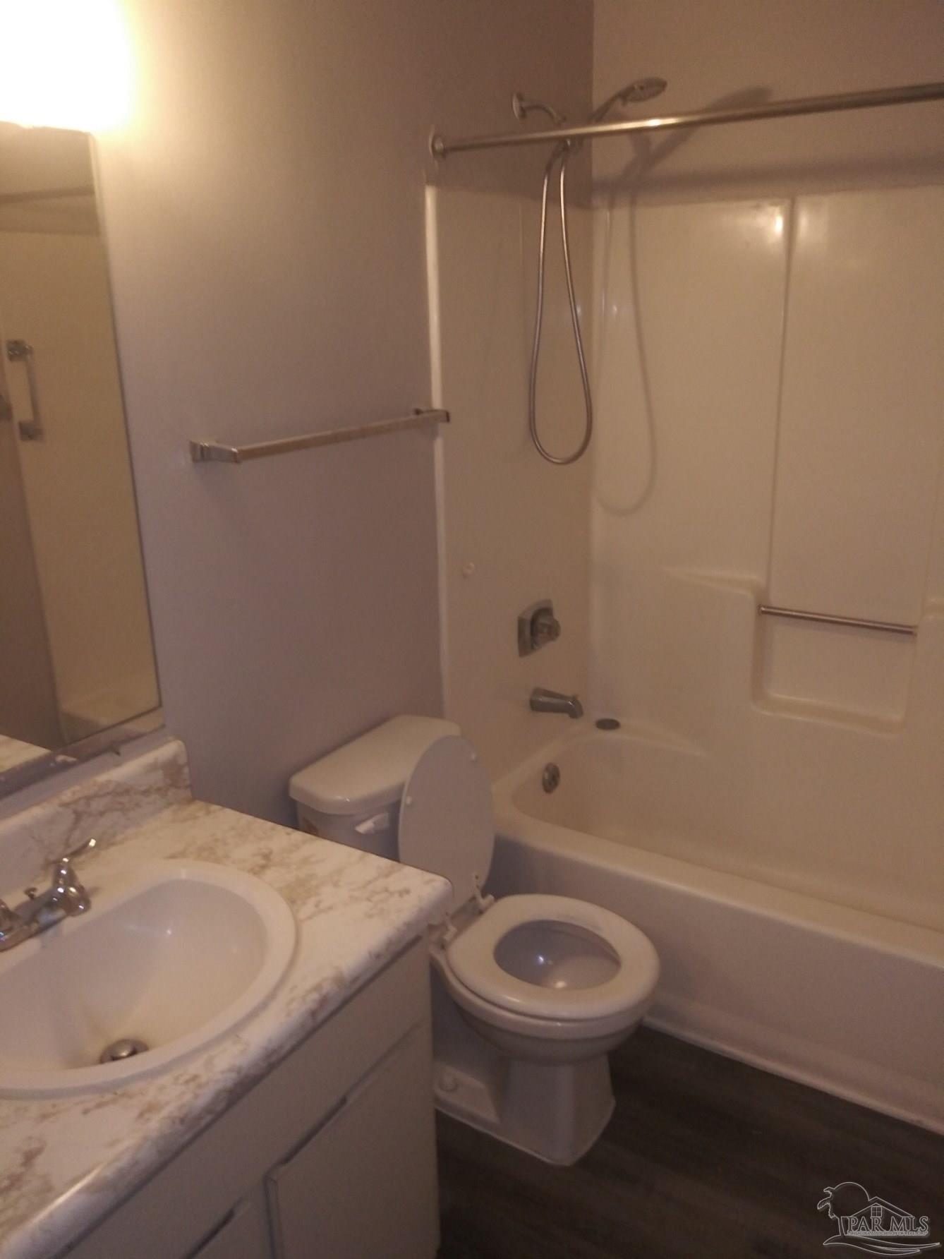 6288 Hamilton Bridge Road, Unit 501 Milton, FL 32570 - Photo 10 of 12 a bathroom with a sink a toilet and shower
