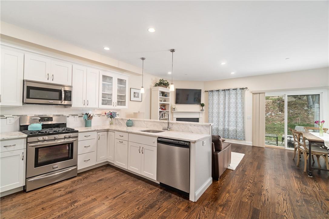 292 Boulder Ridge Road South Salem, NY 10590 - Photo 1 of 1 a kitchen with stainless steel appliances granite countertop wooden floors and sink