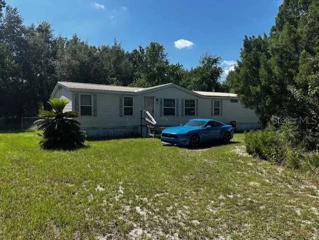 a house view with a garden space