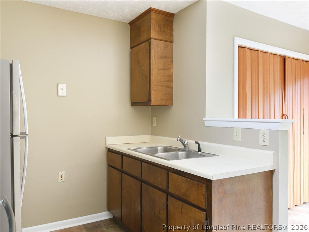 115 Eulon Loop, Unit A Raeford, NC 28376 - Photo 12 of 16 a bathroom with a sink and a mirror