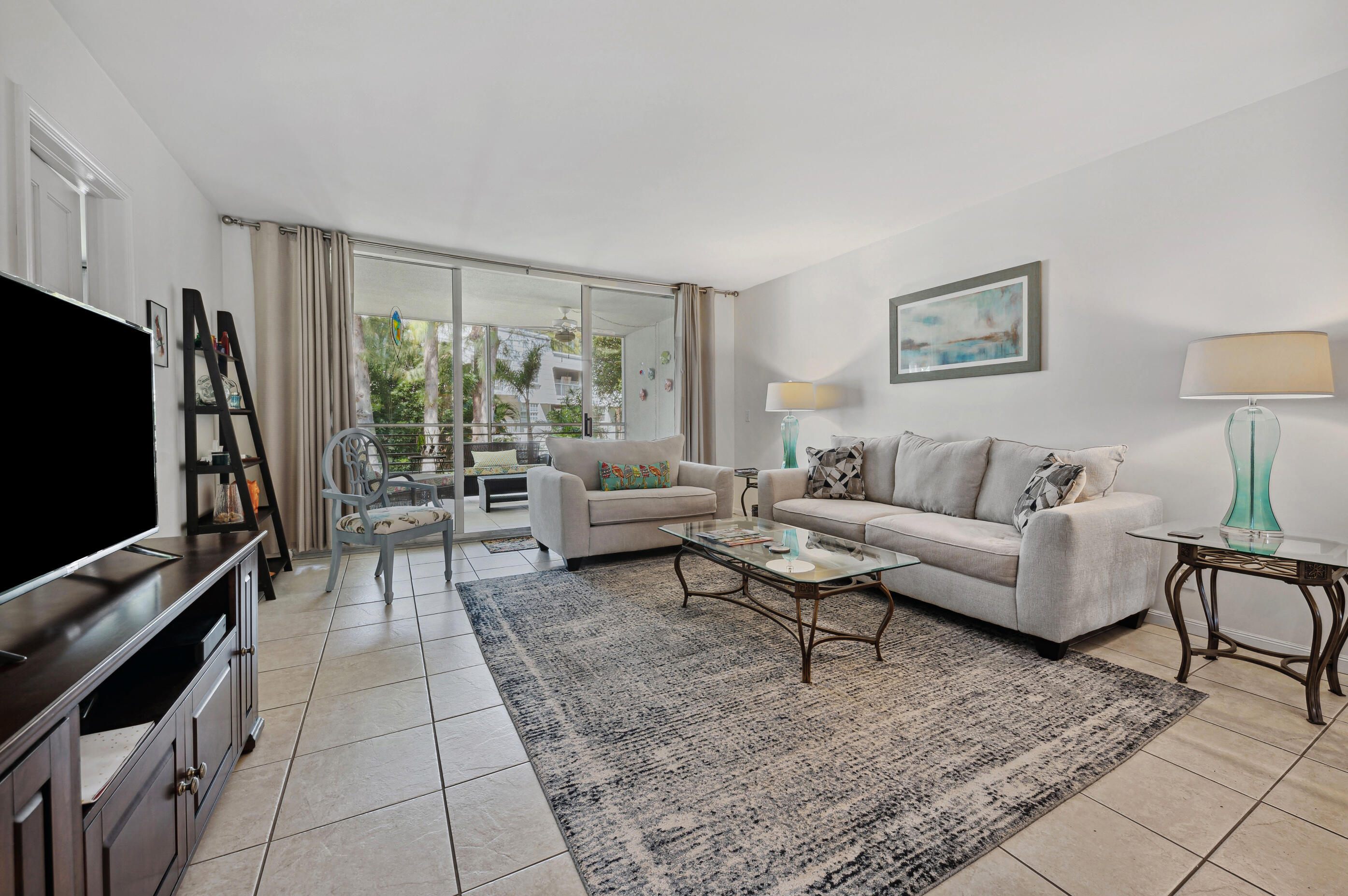 1201 Sugar Sands Boulevard, Unit 8 Riviera Beach, FL 33404 - Photo 6 of 9 living/dining area