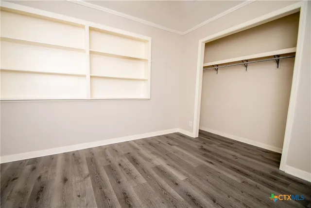 an empty room with a wooden floor