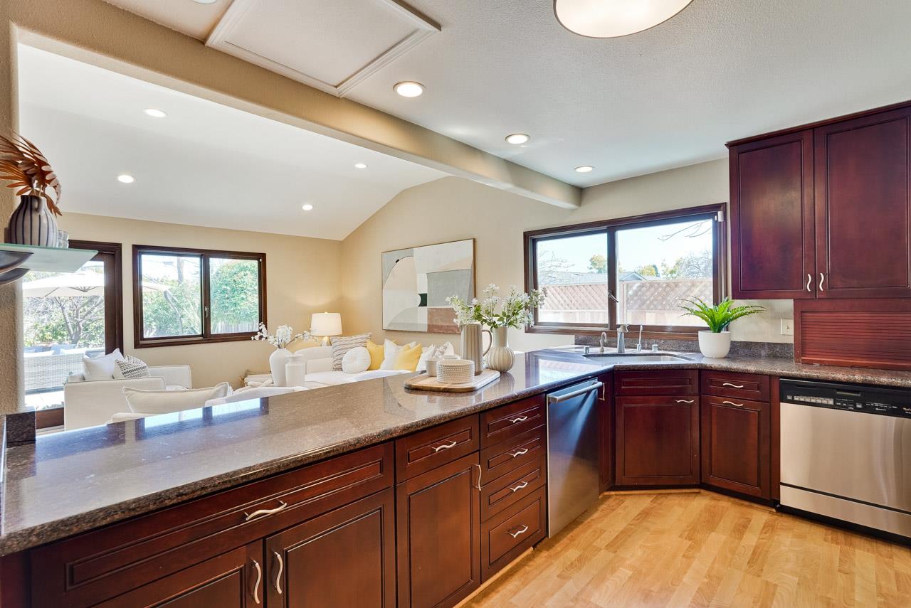 942 September Drive Cupertino, CA 95014 - Photo 17 of 51 a large kitchen with wooden cabinets and dishwasher