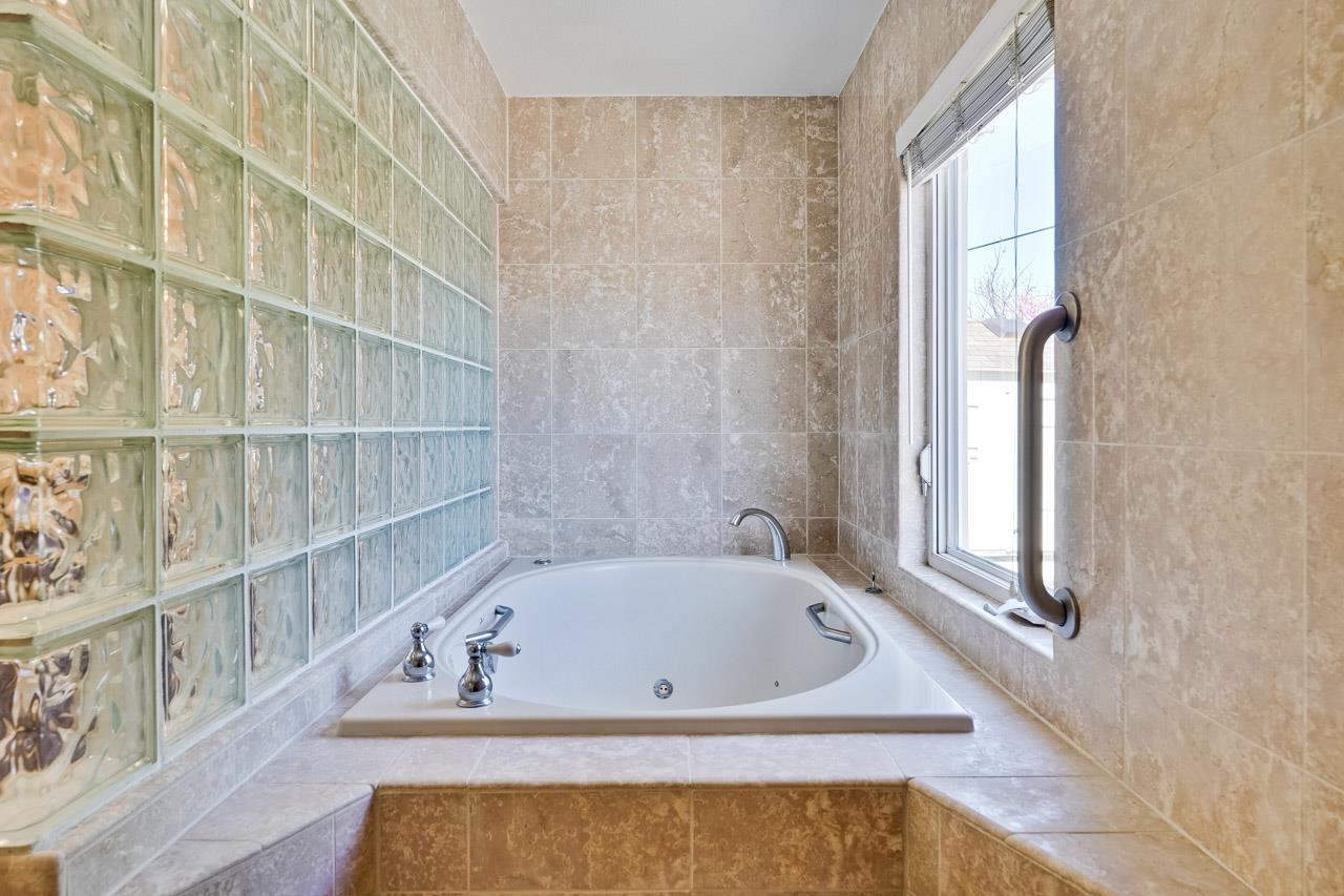 942 September Drive Cupertino, CA 95014 - Photo 33 of 51 a bath tub sitting next to a window