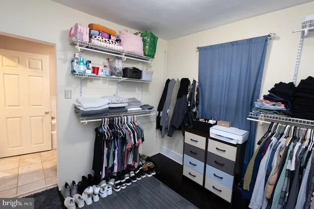 a view of room with guitars and wooden floor